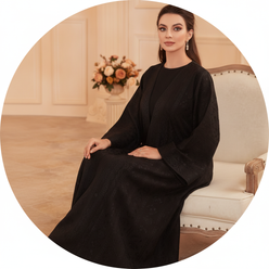 Circular portrait of Reem Al-Hashimi, a Middle Eastern woman, wearing a royal black AMIRA abaya set against a warm cream back